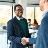 Portrait,Of,A,Young,Businessman,Businessmen,Shaking,Hands,Introducing,Each