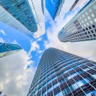 Glass,And,Steel,Office,Towers,Rise,Above,The,Streets,Of